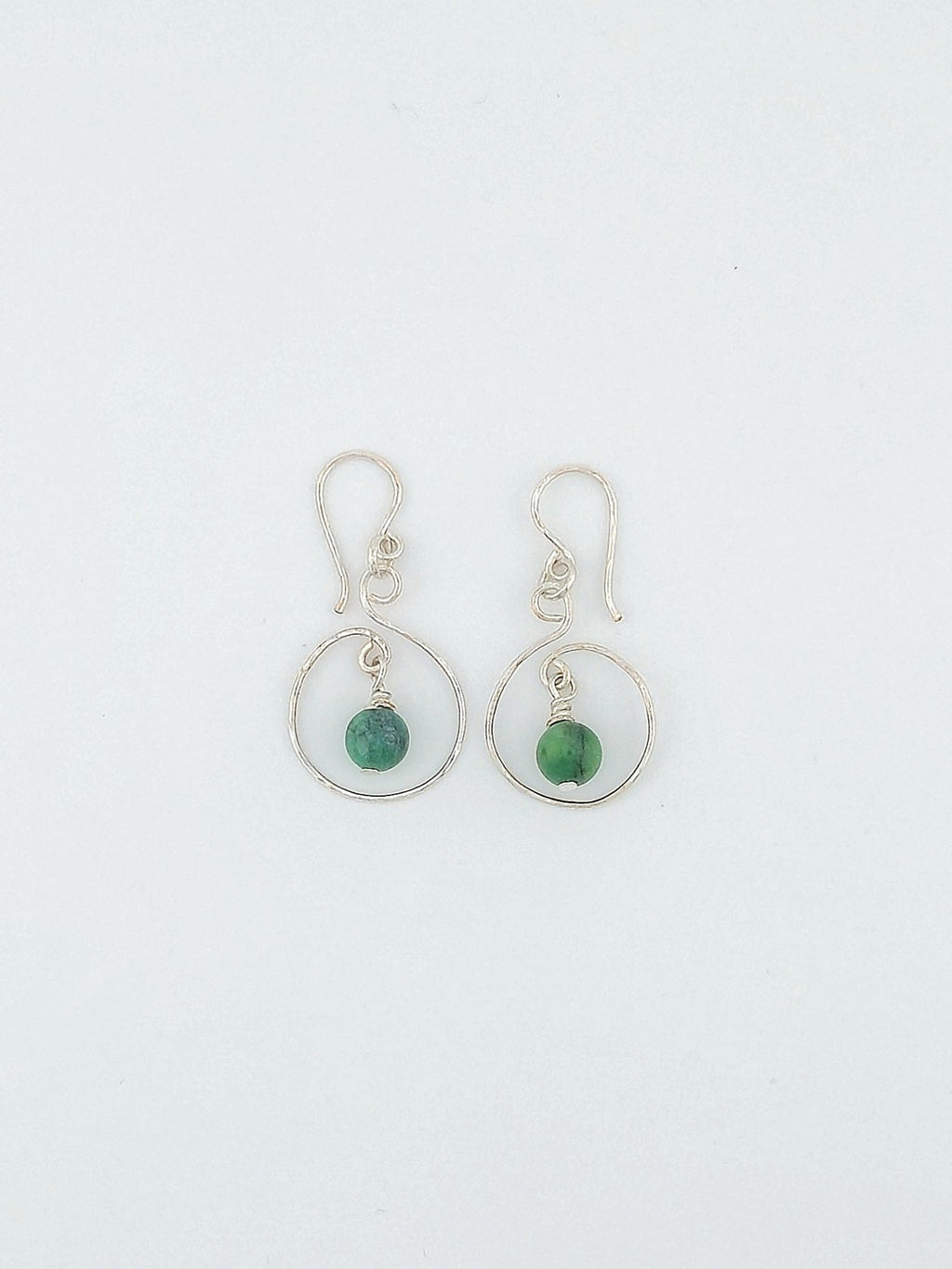 Handcrafted silver open swirl earrings with green tourmaline gemstone drops by Willow Tree Studio.
